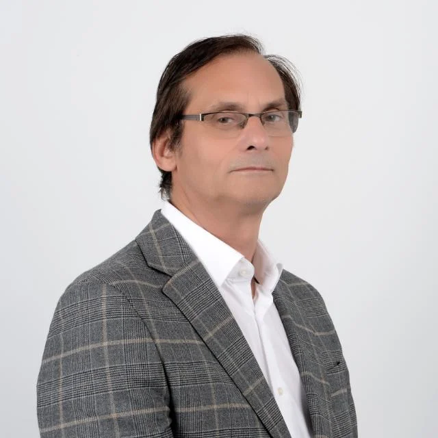 Portrait of the CTO of intech Heritage, expert in AI architecture and advanced software engineering.